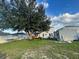 Spacious backyard with large tree and shed at 1054 N Platte Way, Kissimmee, FL 34759