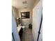 Small half bathroom with toilet and sink at 1054 N Platte Way, Kissimmee, FL 34759