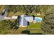 Aerial view of home with in-ground pool, fenced backyard and carport at 1507 Hontoon Rd, Deland, FL 32720