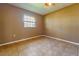 Clean bedroom with tiled flooring and window providing natural light at 1507 Hontoon Rd, Deland, FL 32720