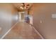 Open hallway design features neutral tile flooring and natural light at 1507 Hontoon Rd, Deland, FL 32720