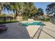 In-ground pool surrounded by a fence and lounging furniture at 1507 Hontoon Rd, Deland, FL 32720