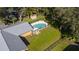 Inviting kidney-shaped pool with surrounding fence at 1507 Hontoon Rd, Deland, FL 32720