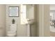 Clean powder room with pedestal sink and neutral color palette at 3112 Springbank Dr, St Cloud, FL 34771