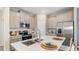 Modern kitchen featuring stainless steel appliances and a large island at 5758 Meditation Dr, Clermont, FL 34714