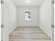 Bedroom with plank flooring and a window at 1254 Lakeridge Way, Lake Alfred, FL 33850