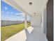 Spacious covered patio overlooking the backyard, perfect for outdoor entertaining at 1254 Lakeridge Way, Lake Alfred, FL 33850