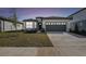 Charming single-Gathering home with a two-car garage, well-manicured lawn, and inviting curb appeal at 1254 Lakeridge Way, Lake Alfred, FL 33850