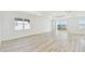 Bright and open living room with hardwood floors, recessed lighting, and backyard views at 1254 Lakeridge Way, Lake Alfred, FL 33850