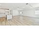 Open-concept kitchen and living room featuring hardwood floors and recessed lighting at 1254 Lakeridge Way, Lake Alfred, FL 33850