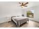 Spacious bedroom with large window, ceiling fan and gray bedding at 1295 Evergreen Park Cir, Lakeland, FL 33813