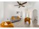 Bright living room with gray sofa and orange armchairs at 1295 Evergreen Park Cir, Lakeland, FL 33813