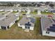 Aerial view of houses with solar panels, showcasing a community at 1734 Hill Top Dr, Dundee, FL 33838