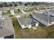 Aerial view of houses with solar panels, showcasing a community at 1734 Hill Top Dr, Dundee, FL 33838