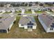 Aerial view of houses with solar panels, showcasing a community at 1734 Hill Top Dr, Dundee, FL 33838