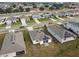 Aerial view of houses with solar panels, showcasing a community at 1734 Hill Top Dr, Dundee, FL 33838