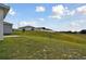 Landscaped backyard with elevated view of surrounding homes at 1734 Hill Top Dr, Dundee, FL 33838