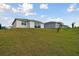 Elevated backyard view, showcasing surrounding landscape at 1734 Hill Top Dr, Dundee, FL 33838