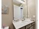 Bathroom vanity with a large mirror and white countertop at 1734 Hill Top Dr, Dundee, FL 33838