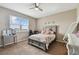 Bedroom with a bed, dresser, desk, and large window at 1734 Hill Top Dr, Dundee, FL 33838