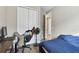 Bedroom with twin bed, desk, and access to another room at 1734 Hill Top Dr, Dundee, FL 33838