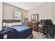 Bedroom with a double bed, dresser, and workspace at 1734 Hill Top Dr, Dundee, FL 33838