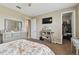 Bedroom with a bed, dresser, and walk-in closet at 1734 Hill Top Dr, Dundee, FL 33838