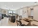Open concept dining area adjacent to kitchen and living room at 1734 Hill Top Dr, Dundee, FL 33838