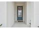 Front entrance with a blue door and glass accents at 1734 Hill Top Dr, Dundee, FL 33838