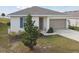 One-story home with attached garage and landscaping at 1734 Hill Top Dr, Dundee, FL 33838