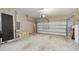 Attached garage with overhead door and ample space at 1734 Hill Top Dr, Dundee, FL 33838
