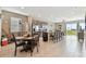 Open kitchen with island, stainless steel appliances, and breakfast nook at 1734 Hill Top Dr, Dundee, FL 33838
