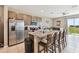 Island kitchen with granite countertops and breakfast bar seating at 1734 Hill Top Dr, Dundee, FL 33838