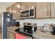 Kitchen with stainless steel appliances and granite countertops at 1734 Hill Top Dr, Dundee, FL 33838