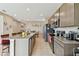 Modern kitchen with granite countertops and stainless steel appliances at 1734 Hill Top Dr, Dundee, FL 33838