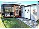 Relaxing backyard oasis with a covered patio, storage shed, and lush landscaping at 225 Temple Cir, Eustis, FL 32726
