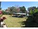 Covered boat lift and canal access provide convenient waterfront living at 225 Temple Cir, Eustis, FL 32726