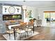 Elegant dining room with a stone fireplace and hardwood floors at 225 Temple Cir, Eustis, FL 32726