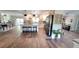 Spacious open-concept kitchen featuring a large island with seating and modern appliances at 225 Temple Cir, Eustis, FL 32726
