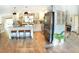Modern kitchen with white cabinets, stainless steel appliances, and an island at 225 Temple Cir, Eustis, FL 32726