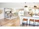Open concept kitchen and dining area with modern appliances and fireplace at 225 Temple Cir, Eustis, FL 32726