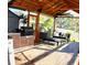 Relaxing screened patio with outdoor kitchen and comfortable seating at 225 Temple Cir, Eustis, FL 32726