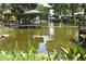 Peaceful water view with docks, offering a serene waterside setting at 225 Temple Cir, Eustis, FL 32726