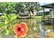 Scenic waterfront view with calm waters and lush vegetation at 225 Temple Cir, Eustis, FL 32726