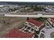 Aerial view of townhouses with red tile roofs, ample parking, and landscaping at 2888 Bella Vista Dr, Davenport, FL 33897