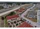Aerial view of townhouses, roads, and surrounding community at 2888 Bella Vista Dr, Davenport, FL 33897