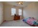 Cozy bedroom with dresser and ceiling fan at 2888 Bella Vista Dr, Davenport, FL 33897