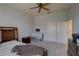 Bedroom with double doors and ceiling fan at 2888 Bella Vista Dr, Davenport, FL 33897