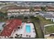 Relaxing community pool with surrounding patio furniture at 2888 Bella Vista Dr, Davenport, FL 33897