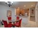 Small dining area with glass table and red chairs at 2888 Bella Vista Dr, Davenport, FL 33897